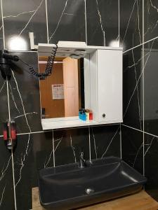 a bathroom sink with a mirror and a phone at 216 Hill Suites in Istanbul +17 photos