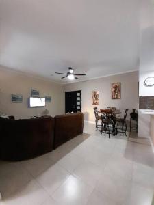 a living room with a couch and a table at Choose To Be Happy at Brompton Estates - One and Two Bedroom with Pool in Kingston