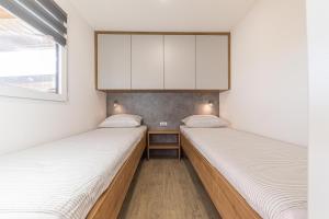 Postel nebo postele na pokoji v ubytování Mobile Home Therapy