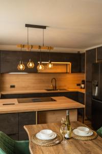 a kitchen with a table with two plates on it at Die entspannendste Wohnung am Edersee - SPA Sauna in Giflitz