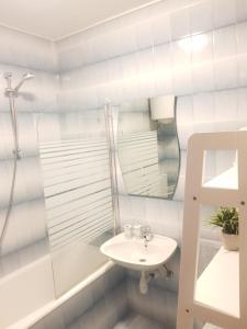 a bathroom with a sink and a mirror at Apartments Huljić in Hvar