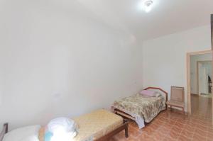 Katil atau katil-katil dalam bilik di apartamento CAMURÇA