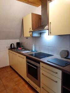 a kitchen with a stove and a stove top oven at Fewo klein aber fein 