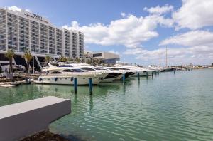 a group of boats docked at a marina with a hotel at NEW LISTING - Eden Villas in Vilamoura