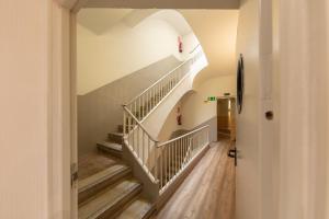 a hallway with stairs in a house at Standbyme Ramblas in Barcelona