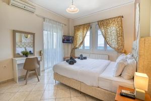 Posteľ alebo postele v izbe v ubytovaní Votsalakia Hotel & Luxury Apartments