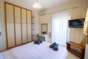 Posteľ alebo postele v izbe v ubytovaní Votsalakia Hotel & Luxury Apartments