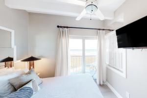 Ένα ή περισσότερα κρεβάτια σε δωμάτιο στο Aquarius Condominiums #504 +12 φωτογραφίες