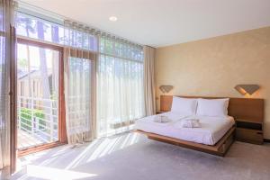 Postel nebo postele na pokoji v ubytování Rixwell Collection Seaside Hotel Jurmala