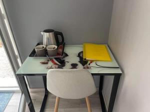 a desk with a dog on it with a book on it at La Petite Salamandre in Chitenay