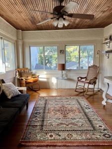 a living room with a couch and a rug at Historic Oak Park Residence in Oak Park