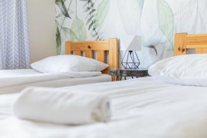 Posteľ alebo postele v izbe v ubytovaní Apartamenty Przylesie