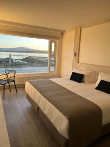 Postel nebo postele na pokoji v ubytování Hotel Costanera