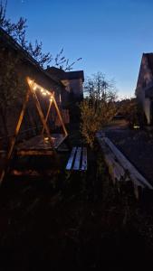 a picnic table with a light on top of it at Studio Rasnov Apartaments in Râşnov