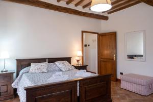 Postel nebo postele na pokoji v ubytování Podere Montale Il Borgo