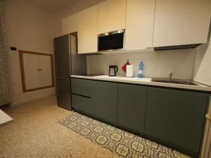 a kitchen with a sink and a counter top at From Pedrotti in Desenzano del Garda +12 photos