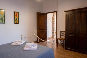 Postel nebo postele na pokoji v ubytování Podere Montale Il Borgo