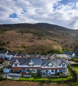 an aerial view of a large house on a hill at Cae Glas in Penmaen-mawr