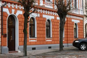 a car parked in front of a building at Zlaty Lev in Louny