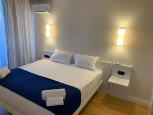 Ένα ή περισσότερα κρεβάτια σε δωμάτιο στο Orbi City 34 SEA VIEW