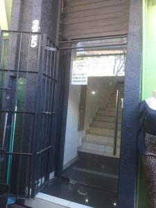 a glass door with a staircase in a building at Edificio O'Hara Ap3 in Ciudad del Este