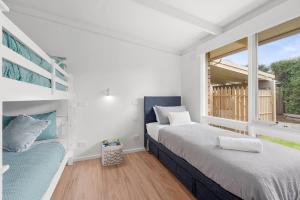 Ένα ή περισσότερα κρεβάτια σε δωμάτιο στο Relax and Unwind Near Rye Beach