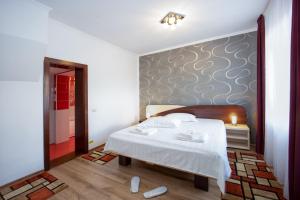 Postel nebo postele na pokoji v ubytování Amedeia