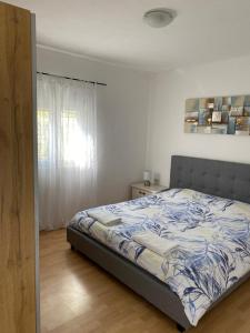 Katil atau katil-katil dalam bilik di Holiday house Ana