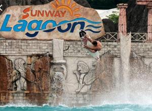 a man jumping off of a water fountain at a water park at Sunway Geo Avenue / Sunway Medical Centre / Pyramid / Lagoon in Petaling Jaya
