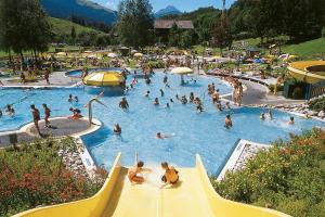a group of people in a swimming pool at Ferienwohnung Stöckl in Leogang