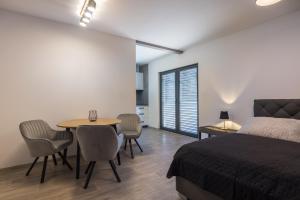Postel nebo postele na pokoji v ubytování Apartmány Na Lánech