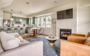 a living room with a couch and a fireplace at Organic by Nature in Depoe Bay