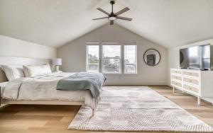 a bedroom with a bed and a ceiling fan at Organic by Nature in Depoe Bay