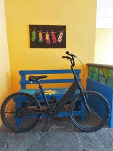 a bike parked next to a blue bench at HOTEL INTI in Boca del Río