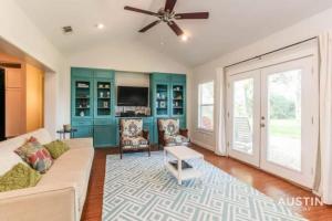 a living room with a couch and a ceiling fan at Retreat to the Outdoors with Colorado River Access in Austin