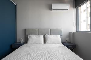 a bedroom with a large bed with two night stands at #Luxlikehome Lux Locals 1 in Thessaloniki