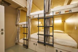 Postel nebo postele na pokoji v ubytování K2 Guesthouse Central