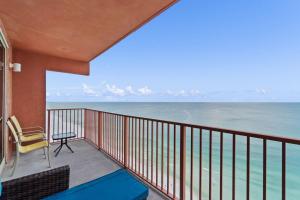 a balcony with a view of the ocean at Shores of Panama #2302 by Nautical Properties in Panama City Beach