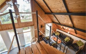 an overhead view of a living room in a log cabin at Three-Bedroom Holiday Home In Romo in Mølby +13 photos