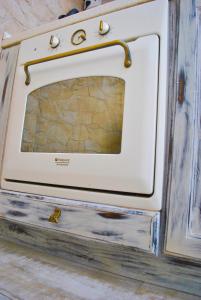 an old oven with a door on top of it at Apartment Mediterraneo Blue Sky in Perast