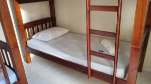 a pair of bunk beds in a room at Pousada São José in Guaratinguetá +63 photos
