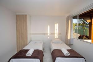 Ένα ή περισσότερα κρεβάτια σε δωμάτιο στο Bz20 Geribá com vista panorâmica! 6 quartos +37 φωτογραφίες