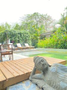 a statue of a mermaid sitting on a table at Ekaa Hotel in Palomino
