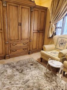 a living room with a couch and a cabinet at شقة لين طيبة للعوائل Leen Taibah Ap. for family's in Al Madinah