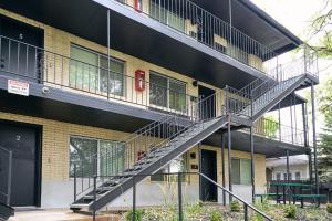 a spiral staircase on the side of a building at Convenient - Near Hospitals - King Bed in Salt Lake City