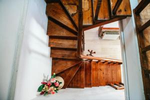 a room with a wooden wall and flowers on the floor at Serenità in Lefkimmi +56 photos