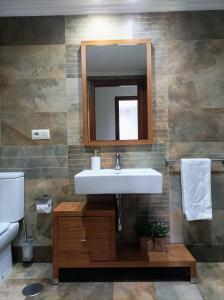 a bathroom with a sink and a mirror at Marvera in Caldas de Reis +32 photos