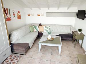 a living room with a couch and a table at Ireon Holiday Home in Ireon