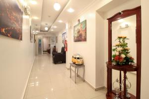 a hallway of a hospital with a waiting room at La Rosario in Quito