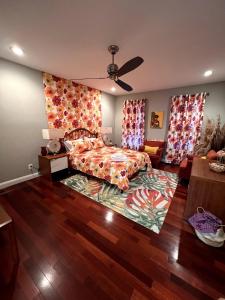 a bedroom with a bed and a rug at Retro-inspired Content House In Patterson Park in Baltimore